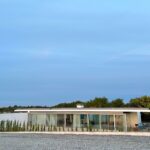 Alcino Soutinho's design of the Soutinho 14 Villas at Bom Sucesso Resort in Obidos, showcasing concrete structures with daylighting features and eco-friendly elements in a villa estate setting.