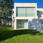 David Chipperfield's Chipperfield 4 Villas no Bom Sucesso showcasing modern villa design with a landscaped garden, swimming pool, and daylighting features at the Bom Sucesso Resort in Obidos.