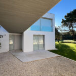 David Chipperfield's Chipperfield 4 Villas no Bom Sucesso showcasing a modern concrete structure with integrated landscaping and ample daylighting at the Bom Sucesso Resort, Obidos.