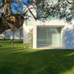 David Chipperfield's Chipperfield 4 Villas at Bom Sucesso Resort in Obidos showcasing modern homes with expansive lawns, lush gardens, and landscaped estates surrounded by grass, shrubs, and shaded areas.